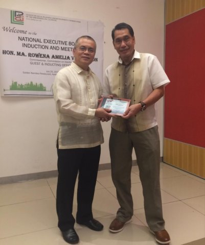 Mr. Jun Aguilar receives his Plaque of Appreciation for his invaluable contribution to the League.